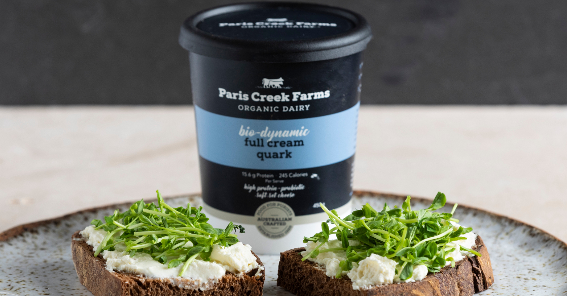 Paris Creek Farms Quark served with herbs. Quark is a soft set fresh cheese product.